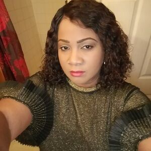 Black and gold sheer  and sparkling gold  blouse. Pleated sleeves